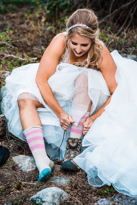 Brides puts on hiking boots to embark on her hiking elopement #adventurebride #mountainbride #adventurewedding #offbeatbride #hikingelopement #elopementattire #elopementgettingready Elopement Shoes Brides, Shenandoah Elopement, On Hiking Boots, Climbing Wedding, Wyoming Elopement, Hiking Elopement, Mountain Bride, Elopement Dress, Elopement Photos