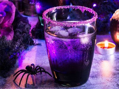 15 Spooky Yet Delicious Halloween Cocktail Recipes To Die For - The XO Factor Purple Moscow Mule, Halloween Mule Cocktail, Halloween Mule Drink, Halloween Moscow Mule, Purple Halloween Punch, Halloween Mule, Spicy Fruit, Mule Drink, Raspberry Cocktail