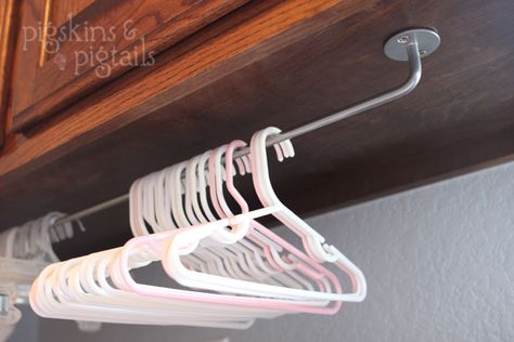 hanger organization under cabinets in laundry room - I like this, and have some IKEA rails on hand, too! Laundry Room Hacks, Laundry Room/mud Room, Laundry Symbols, Room Storage Diy, Organizational Ideas, Hanger Organizer, Laundry Room Remodel, Laundry Closet, Diy Laundry