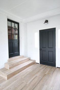 Light Wood Tile Floor, Light Wood Tile, White Mudroom, Plants Furniture, Functional Entryway, Wood Ceramic Tiles, Mudroom Makeover, Painted Interior Doors, Black Paint Color