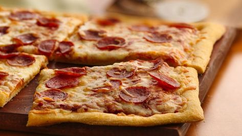 Pepperoni Pizza Recipe - Pillsbury.com Baked Camembert Recipe, Pillsbury Pizza Crust, Pie Crust Pizza, Pillsbury Pizza, Homemade Pepperoni Pizza, Pizza Recipes Pepperoni, Recipes Pizza, Pizza Snacks, Refrigerated Pie Crust