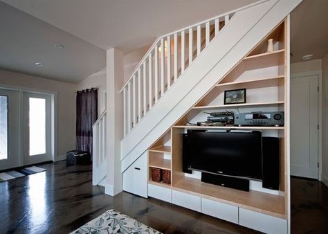 Under the stairs entertainment center Cabinet Under Stairs, Staircase Bookshelf, Under Stairs Storage Solutions, Room Under Stairs, Space Under Stairs, Basement Stairs Ideas, Stairs In Living Room, Stairs Ideas, Staircase Storage