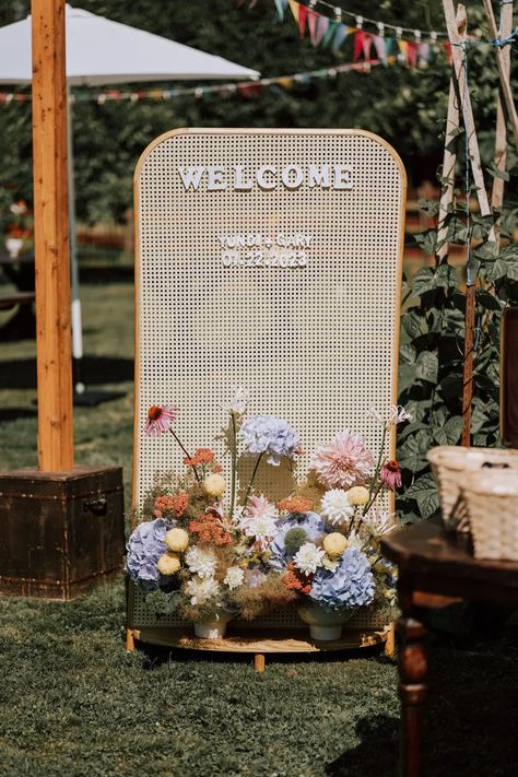 charming rattan wedding welcome sign with pastel primary color floral arrangements for a sunny outdoor ceremony Brides 2024, Bespoke Decor, Minimal Contemporary, Colourful Wedding, Wedding Backdrop Design, Wedding Brides, Organic Wedding, Future Wedding Plans, Decoration Room