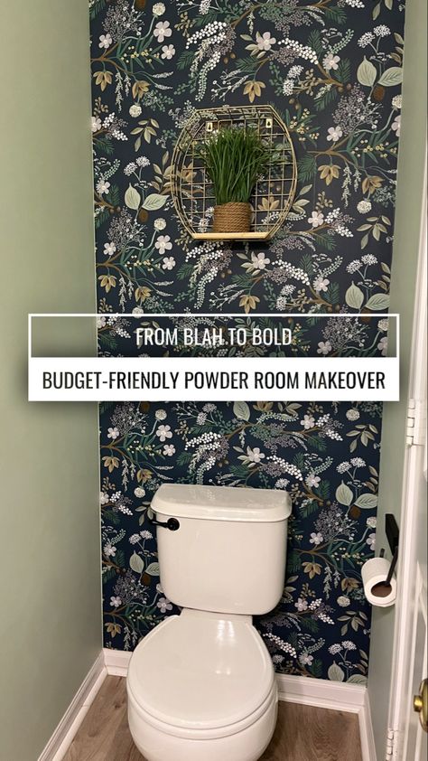 A small bathroom, with the wall behind the toilet covered in a bold print wallpaper. Small Bathroom Under Stairs Wallpaper, Peel And Stick Wallpaper Behind Toilet, Best Peel And Stick Wallpaper Bathroom, Peel And Stick Wallpaper Powder Room, Powder Room Floor Ideas, Wallpaper Behind Toilet, Powder Room Ideas Wallpaper, Dark Powder Room Ideas, Tiny Powder Room Ideas