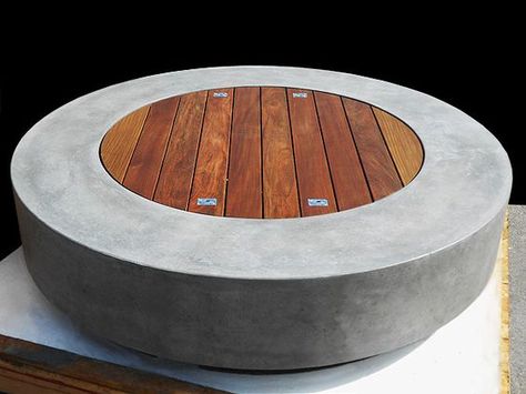 This is our favorite fire pit visually (round or square don't care -- it's the concrete and wood we like) Do you do custom concrete work? Where would we hide the propane tank? Round Concrete Fire Pit, Fire Pit Video, Fire Pit Tables, Fire Pit Gallery, Company Instagram, Concrete Fire Pit, Outside Fire Pits, Fire Pit Materials, Fire Tables