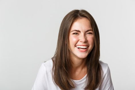 Close-up of happy and carefree brunette girl smiling and laughing from joy, standing white background. Girl Laughing, Offer Poster, Girl Smiling, Close Up Faces, Laughing Face, Girl Smile, Smile Girl, Brunette Girl, Close Up