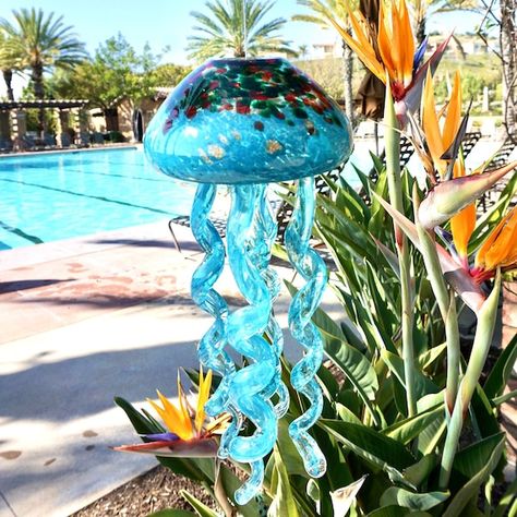 Beautifully handcrafted art glass jellyfish wind chime brings a beautiful touch to your space. Beautiful, hand blown glass bowl is teal with a hint of mix color dot on top. A hole has been drilled in the center to accommodate the jellyfish tentacles. Five hand crafted tentacles are artfully shaped Jellyfish Hanging, Bead Suncatcher, Suncatchers Diy, Hanging Jellyfish, Glass Jellyfish, Jellyfish Decorations, Green Window, Wine Bottle Wind Chimes, Window Suncatchers