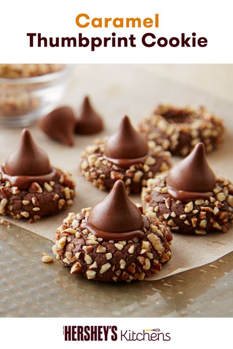 Show off your sweet cookie skills with this Caramel Thumbprint Cookies recipe using HERSHEY'S KISSES Brand Milk Chocolates. Combining pecans, HERSHEY'S Kisses and HERSHEY'S Cocoa, these blossom cookies are the ultimate dessert for the holidays. Make this on your own and wow your holiday guests! Thumbprint Cookies Hershey Kiss, Caramel Thumbprint Cookies, Hersheys Chocolate, Chocolate Thumbprint Cookies, Patisserie Fine, Cookie Sandwich, Desserts Ideas, Thumbprint Cookies Recipe, Blossom Cookies