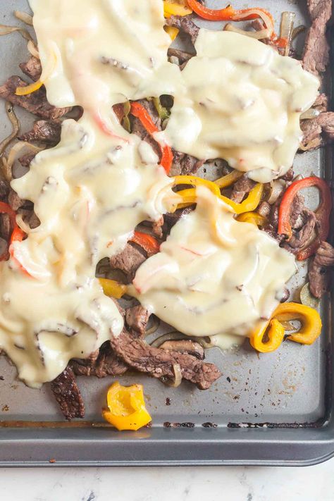 Easy Sheet Pan Cheesesteak Sandwiches. Sheet pan cheesesteaks are an easy and indulgent way to enjoy a Philly sandwich at home. This recipe is simple, with thinly sliced steak, peppers, onions, and mushrooms. Jalapeno peppers add a spicy kick! Philly Cheese Steak Sandwich Recipe, Homemade Philly Cheesesteak, Steak Peppers, Philly Sandwich, Cheesesteak Sandwiches, Philly Cheese Steak Sandwich, Steak Sandwich Recipes, Philly Cheese Steak Sliders, Philly Cheese Steak Recipe