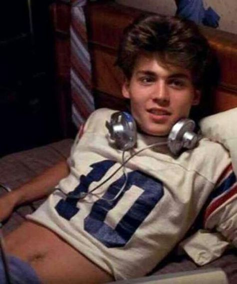 A Nightmare on Elm Street (1984): Johnny Depp accompanied his friend Jackie Earle Haley to auditions for the film. Instead of Haley being chosen for a role, it was Depp who was spotted by director Wes Craven, who asked him if he would like to read for a part. Depp got a part in the film, Haley didn't, but Haley would go on to play Freddy in the remake 26 years later (A Nightmare on Elm Street (2010)). Elm Street, Nightmare On Elm Street, Johnny Depp, Headphones, Football, Bed, American Football