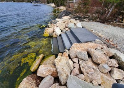 Rip Rap Shoreline, Rip Rap Landscaping, Riprap Shoreline, Shoreline Ideas, Lake Patio, Kayak Launch, Lake Landscaping, Rock Steps, Concrete Walkway