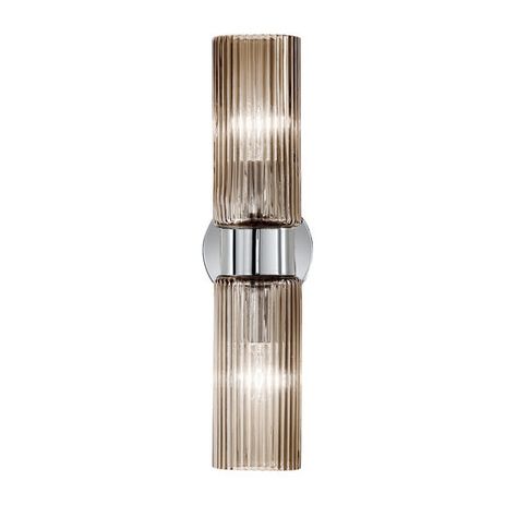 A modern wall-mount lighting with a vintage feel, the Korinthos Sconce provides diffused illumination combined with a sophisticated look inspired by ancient columns. The light flows through the two smoky blown Murano glass diffusers extending on a vertical band on a polished chromed metal plate, producing a dynamic interplay of light along the grooved surface. Set in multiples along a hallway wall or paired with the pendant version of the same collection, this distinctive piece of functional dec Ancient Columns, Hallway Wall, Functional Decor, Wall Anchors, Glass Diffuser, Wall Mounted Light, Metal Plate, Light Sconces, Murano Glass