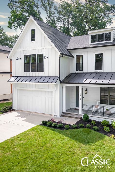 An exterior image of a white modern farmhouse of board and batten, half porch, black iron rails. Flagstone Front Porch, Barn Style Garage, Farmhouse Style Exterior, Farmhouse Craftsman, Spec Home, Hardie Board, House Awnings, Board And Batten Exterior, Farmhouse Exterior Design