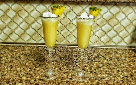 Dole Whip Mimosas are the Perfect Brunch Beverage Disneyland Treats, Disney Vacation Planner, Disney Treats, Brunch Drinks, Perfect Brunch, Dole Whip, Vacation Planner, Frozen Treat, Disney Resorts