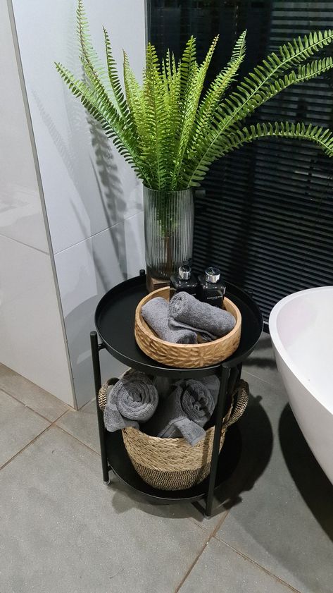 Bathtub Side Table Decor, Free Standing Bath Tub Side Table, Black Bamboo Bathroom, Spa Bathroom Black, Bathroom Side Table Ideas, Table By Bathtub, Black And White Bathroom Decor Apartment, Black And Earthy Bathroom, Bath Tub Accessories Ideas