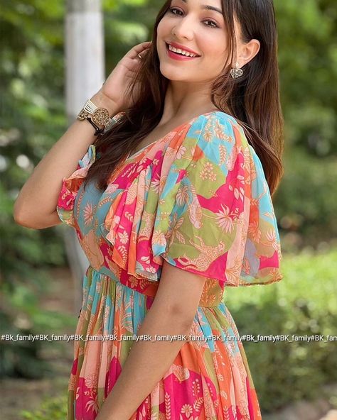 This multicolored dress is crafted from premium Georgette, a lightweight and sheer fabric. It showcases a stunning floral print and is designed with ruffled short sleeves for a playful, stylish touch. The V-neckline offers a sophisticated and flattering look. For convenience, the dress includes a back zipper. It is padded for extra comfort and support, making it perfect for special occasions. (It's come with a back zip and padded) Product Name: Kylie Multi Colour Midi Dress Fabric: Georgette... Frock Models, Multicolored Dress, Indo Western, Sheer Fabric, Sheer Fabrics, Dress Fabric, The Dress, Special Occasion, Floral Print