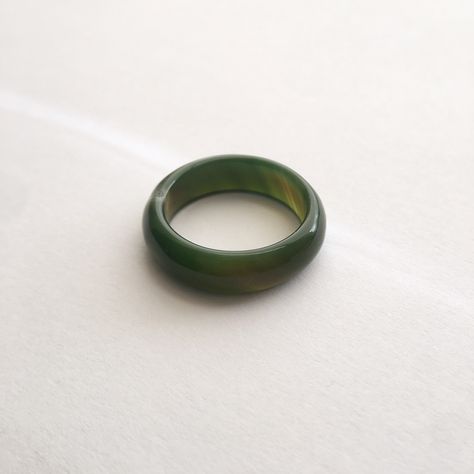 Dark green jade band rings Ring detail~ Width: 5~6mm Jade is a healing stone that symbolizes luck and protection. It is also associated with harmony, balance, and good health. The design of this piece is simple and unique, great for everyday wear, layered or alone. This beautiful piece is also great for yourself or even as a gift! Note: Each piece may vary slightly in color and translucency due to the nature of jade. The pictures have been edited to reflect the colors of the actual piece as clos Green Rings, Jade Ring, Agate Ring, Jade Jewelry, Green Jade, Healing Stone, Good Health, Color Free, Jade Green