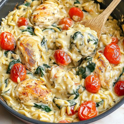 A comforting, easy-to-make Tuscan Chicken Bake with orzo, fresh tomatoes, and spinach all in a creamy sauce. Perfect for a cozy family dinner! Baked Tuscan Chicken Orzo, Creamy Tuscan Chicken Orzo, Orzo Tuscan Chicken Bake, Baked Chicken Orzo, Tuscan Orzo Chicken, Tuscan Chicken Orzo Bake, Dump And Bake Tuscan Chicken, Dump And Bake Tuscan Chicken Orzo, Orzo Chicken Bake