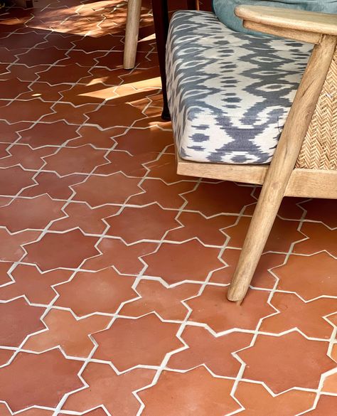 Riad Tile's terracotta is handmade using natural materials and sourced from Canada, providing a classic earth-tone look to spaces indoors and out. Our Star & Cross motif adds warmth and character to this charming sunroom.  Design | 📸: @katepearcevintage Star Cross Tile, Cross Tile, Riad Tile, Shop Tile, Terracotta Tile, Zellige Tiles, Rectangle Tiles, Patio Tiles, Zellige Tile