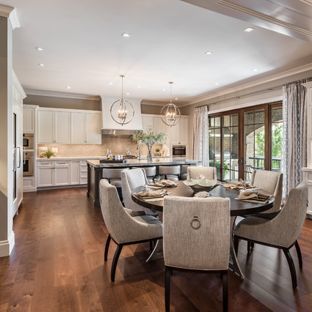 Example of a transitional dark wood floor and brown floor kitchen/dining room combo design in Other with gray walls Walnut Floor Dining Room, Dining Room With Balcony, Transitional Dining Room Ideas, Dark Grey Dining Room, Dark Wood Dining Room, Room With Balcony, Kitchen Dining Room Combo, Brown Dining Room, Light Wood Kitchens