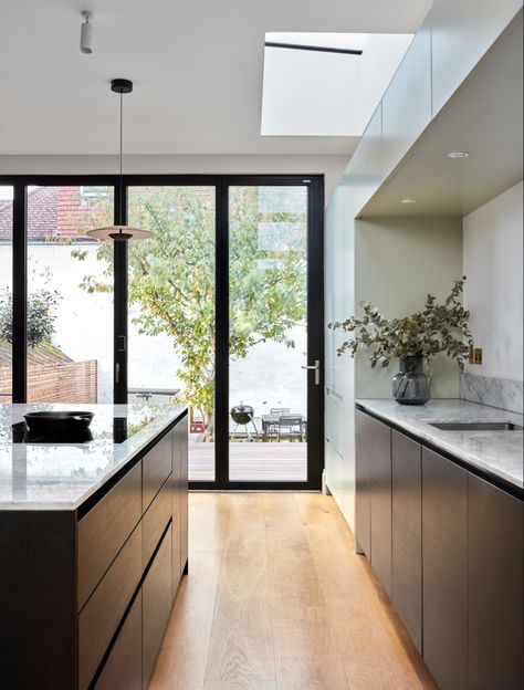 An open plan kitchen with large island and bifold doors Wrap Around Extension, Modern Metal Kitchen, Contemporary Style Kitchen, Glass Extension, Period Property, Kitchen Installation, Scandi Design, Timber Cladding, Elegant Kitchens