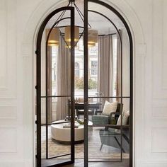 refined black metal frame double height arched doors will highlight your sophisticated and super chic design and add style to it Kensington Apartment, Interior Design Per La Casa, 카페 인테리어 디자인, Arched Doors, London Apartment, Design Del Prodotto, Design Living Room, House Inspo, Dream Home Design