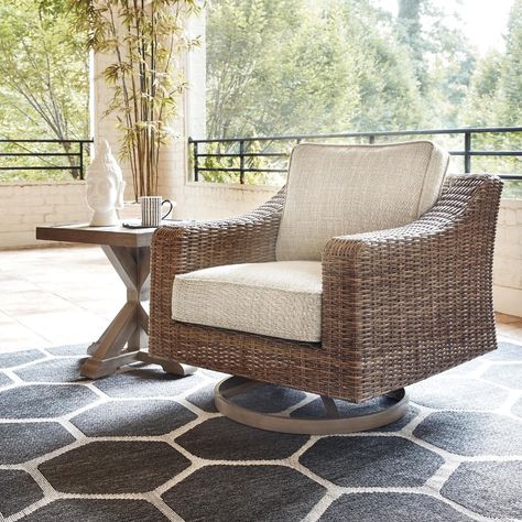 The exquisite look of hand-woven wicker is featured on this Ashley Furniture Beachcroft Beige and Brown Hand-woven Wicker-look Swivel Lounge Chair with 360-degree swivel motion. Swivel Rocker Chair, Teak Patio Furniture, Swivel Lounge Chair, Aluminum Chairs, Set Sofa, Rocker Chairs, Fire Island, Patio Lounge Chairs, Patio Lounge