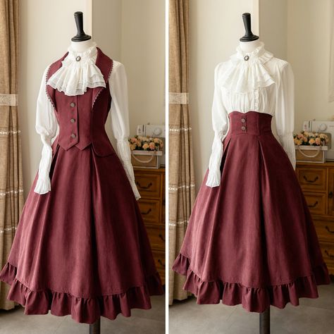 A high-waisted classic skirt, vest, and cavalier blouse that gives you the feel of an elegant British lady. The back of the skirt is decorated with lace-up, and the flowing silhouette gives an impression of elegance and elegance. The high-necked blouse has a decorated chest ornament, giving it a noble feel. An eternal style that shines through time.     Item     Skirt (*with headband of the same color)   Best   Blouse (*with chest decoration)         Size     Skirt     S size     Total length: 8 British Lady, Medieval Princess, Vest Blouse, Old Fashion Dresses, Classic Skirts, Dress Design Sketches, Fantasy Gowns, Vestidos Vintage, Women's Fashion Dresses