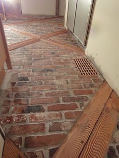 DIY:  How to Install a Brick Veneer Farmhouse Floor - this post shows how salvaged 2x4's, Durock and brick veneers were installed on a plywood base. This looks like an authentic 100 year old farmhouse floor - via 1900 Farmhouse:  Kitchen Floor Farmhouse Kitchen Floor, Brick Floor Kitchen, 1900 Farmhouse, Brick Floor, Farmhouse Flooring, Brick And Wood, Brick Veneer, Floor Remodel, Casa Patio