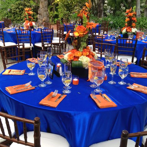 Great wedding color combination ...our friend had great taste Blue Orange Silver Party Decorations, Orange And Blue Aesthetic Party, Orange Blue Party Decor, Royal Blue Orange Wedding, Blue And Orange Event Decor, Royal Blue And Orange Wedding Theme, Royal Blue And Burnt Orange Wedding, Orange And Blue Wedding Theme, Orange And Blue Wedding Colors