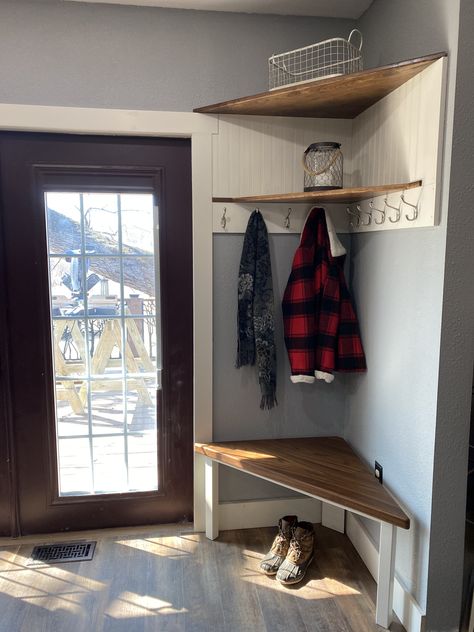 My brother built this custom corner shoe/coat storage center with solid walnut shelves, a bead board back and plenty of hooks.  It effectively utilized an awkward corner that was too small for anything useful. Small Entrance With Storage, Corner Shoe Storage Entryway, Coat Corner Ideas, Kitchen Coat Storage, Corner Shoe And Coat Storage, Corner Storage Hallway, Coat Hanging Ideas For Small Spaces, Corner Shelves Entryway Small Entry, Corner Shoe Storage Ideas