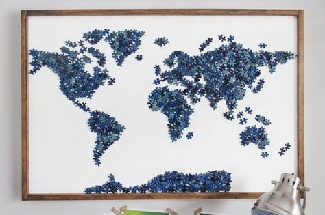 How to repurpose old puzzles with missing pieces into a beautiful statement piece of map wall art. Includes tips on two methods for attaching the stained frame. Puzzle Piece Art, Puzzle Piece Crafts, Puzzle Crafts, Metal Tree Wall Art, Puzzle Art, Glue Crafts, Map Wall Art, Blue Interior, Map Wall