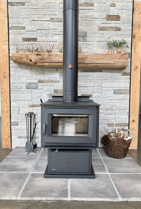 MCB Wood Stove + Chimney Rustic Wood Burning Fireplace, Rock Wall For Wood Stove, Mantel Behind Wood Stove, Free Standing Wood Burning Stove With Mantle, Wood Stove In Basement, Wood Stove Backing, Wood Stove Brick Surround, Mantle Over Wood Stove, Brick Behind Wood Stove