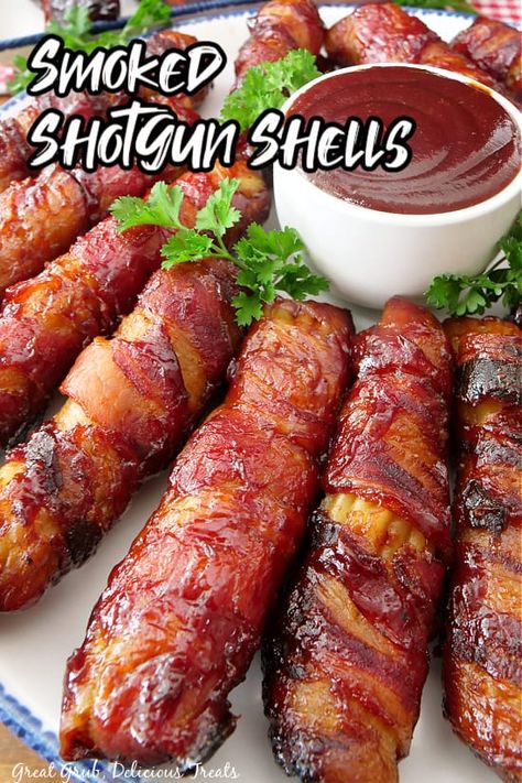 These delicious smoked shotgun shells are loaded with a mixture of ground beef, hot Italian sausage, onions, jalapenos, sharp cheddar cheese, a blend of seasonings, barbecue sauce, all stuffed into manicotti shells, wrapped in bacon, basted in more barbecue sauce and smoked to crispy perfection. Shotgun shells? That sounds dangerous, doesn’t it? Well, this recipe...Read More Smoked Shotgun Shells, Recipes Steak, Honey Barbecue, Pellet Grill Recipes, Smoked Meat Recipes, Mild Italian Sausage, Appetizers Easy Finger Food, Delicious Appetizer Recipes, Stuffed Shells Recipe