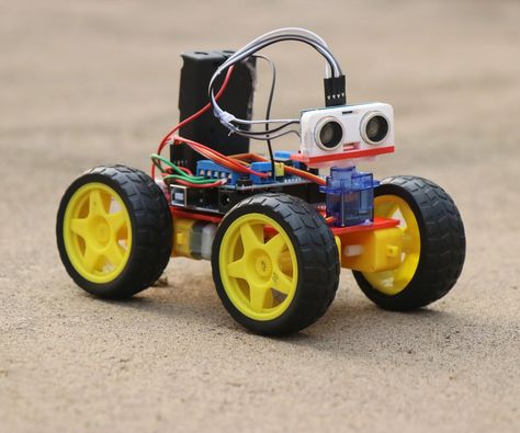 How to Make Obstacle Avoiding Car Using Arduino: Hey guys in this project I have made an Obstacle avoidance car that uses arduino, This robotic car will automatically avoid going in the path of any obstacles! How cool is that?  This robot car serves as an ultimate source of learning if you are will… Diy Electric Toys, Arduino Robot, Creative Technology, Portable Tv, Robotics Projects, Electronics Mini Projects, Arduino Projects, Scanners, Electronics Projects