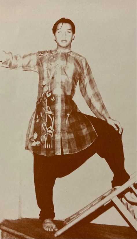 A long, plaid Ernest Santiago Barong Tagalog with garden embroidery, collarless, full button down design,  paired with drop crotch pants circa late 1970’s 1920s Filipino Fashion, Pre Colonial Philippines Clothing, Streetwear Philippines, Filipino Fashion Street Styles, Filipino Streetwear, Filipino Barong, Filipino Traditional Clothing, Philippine Traditions, Philippines Outfit