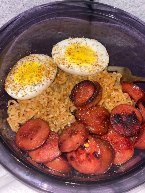 Beef ramen Hard boiled egg Roger Wood spicy snoked sausage Old bay seasoning Garlic powder Onion powder Eat! Ramen Boiled Egg, Ramen With Sausage And Egg, Ramen With Boiled Egg, Ramen Boiled Egg Recipe, Ramen With Sausage, Boiled Egg Meals, Sausage Ramen, Noodles And Eggs, Onion Boil