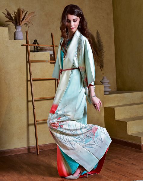 Delicate light sky-blue kimono / kaftan, crafted from 100% mulberry silk adorned with habotai silk lining, meticulously hand-painted by skilled textile artists. Its design is a symphony of Japanese motifs: The Japanese water Iris, known as Shoubu 花菖蒲. Its vibrant purple blooms stand tall and proud and are renowned for the elegant appearance. Blossoming flowers indicate the upcoming season of rain, which is essential for the rice crops. The sparrow, or Suzumeすずめ, is a beloved symbol of joy, f... Water Iris, Japanese Motifs, Kimono Kaftan, Japanese Water, Habotai Silk, Blue Kimono, Vibrant Purple, Textile Artists, Stand Tall