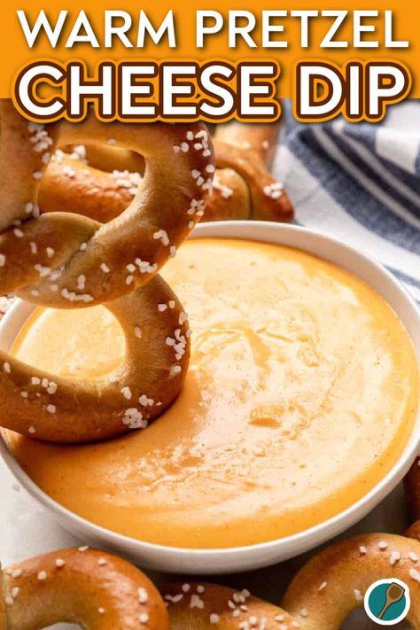 A warm, soft pretzel being dipped into a bowl of creamy cheese dip, topped with a sprinkle of salt. Dip For Pretzels Easy, Sharp Cheddar Recipes, Pretzel Dips Easy, Pretzel Mustard Dip, Warm Cheese Dip Recipes, Game Day Dips Football Season, Soft Pretzel Dip, Cheese Dip For Soft Pretzels, Cheese Dips Recipes