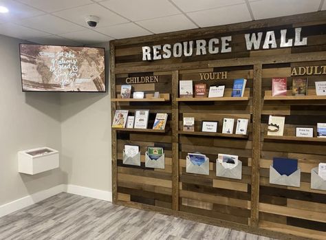 Fun Waiting Room Ideas, Community Center Decor Ideas, Nonprofit Office Design, Welcome Desk Church, Fellowship Hall Decor Church, Church Connection Center, Church Library Ideas, Church Resource Wall, Church Entryway Decor Foyers