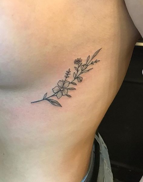 Hip Tattoos Women Outline, Small Rib Flower Tattoo, Marigold Rib Tattoo, Wild Flower Rib Tattoo, Tulip Rib Tattoo, Upper Hip Tattoos Women Small, Flower Tattoos Rib Cage, Wildflower Rib Tattoo, Rib Floral Tattoo