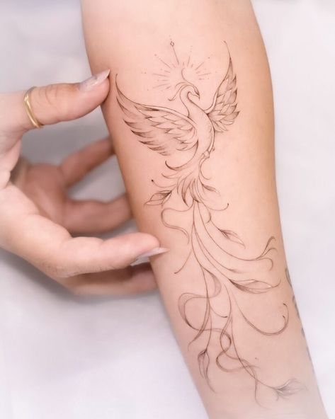 20 Phoenix Tattoos To Inspire Strength And Hope For Better Days Ahead Phoenix Tattoo Feminine Hand, Sunflower Phoenix Tattoo, Delicate Phoenix Tattoos For Women, Phoenix And Compass Tattoo, Phoenix Half Sleeve Tattoo For Women, Phonex Tattoo Meaning, Fierce Feminine Tattoos, Phoenix Simple Tattoo, Phonex Tattoo Drawings