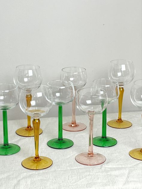 Collection of different wine glasses varying in coloured stems. Vintage wine glasses Vintage Glassware Display, Mid Century Lamps, Glassware Display, Wine Glasses Vintage, Vintage Cocktail Glasses, Mid Century Glassware, Saving The Planet, Funky Decor, Colored Glassware