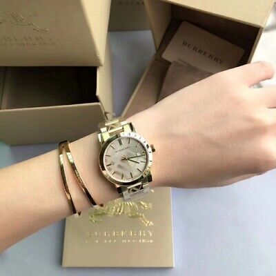 NEW GENUINE BURBERRY THE CITY BU9033 STAINLESS STEEL YELLOW GOLD WOMENS WATCH | eBay Burberry Watch Women, Gold Womens Watch, Gold Display, Burberry Watch, Sapphire Band, Yellow Gold Bracelet, Bracelet Gold, Swiss Made, Edge Design