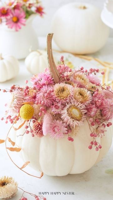 Janine Waite on Instagram: "I’ve decorated a lot of pumpkins but this is my first time covering it in dried straw flowers and pepper berries! 

This project takes like ten minutes or less to do and it comes out so pretty. If you have a bouquet of straw flowers you’re in luck since you won’t have to buy them. I do include the links over on my tutorial. 

Comment, LINK, and please follow me in order to receive the diy link  in your DMs. 

I found the pepper berries around my neighborhood, but I also have a link to them too! They are so so dainty and pretty! 

This pumpkin diy is part of more pumpkin projects by my friends:
@my100yearoldhome 
@tatertotsandjello 
@mysweetsavannah 
@most_lovely_things 
@mscraftberrybush 

Have a wonderful Saturday! 

Photo: @yam_i_yam" Pumpkin Flower Arrangements, Pumpkin Flower Arrangement, Pumpkin And Flowers, Pumpkin With Flowers, Monogram Pumpkin, Flower Pumpkin, Decoupage Pumpkins, Straw Flowers, Pumpkin Vase