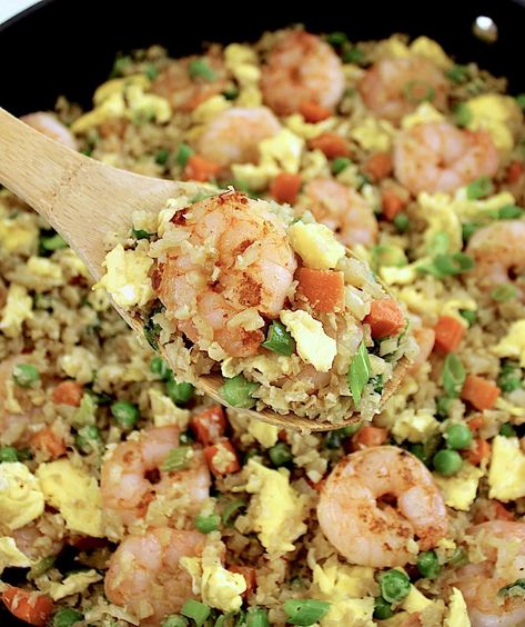 Shrimp Cauliflower Fried Rice This quick and easy Shrimp Cauliflower Fried Rice features juicy shrimp and tender veggies infused with savory Asian flavors. It's the perfect solution for satisfying those Chinese takeout cravings. Cauliflower Shrimp Fried Rice, Shrimp Cauliflower Rice, Shrimp Cauliflower Fried Rice, Shrimp Fried Cauliflower Rice, Cauliflower Fried Rice Keto, Kimchi Fried Cauliflower Rice, Shrimp Cauliflower, Hawaiian Fried Rice, Zucchini In The Oven