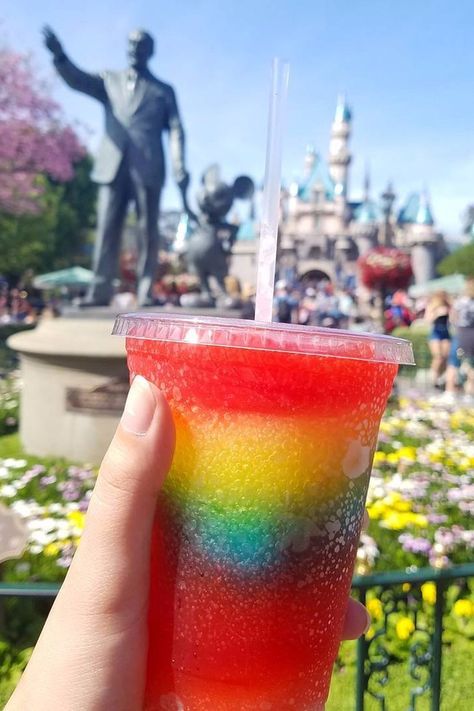 The Most Instagrammable Drink at Disneyland Disneyland Drinks, Best Disneyland Food, Rainbow Drinks, Disney Drinks, Rainbow Lollipops, Disneyland Food, Colorful Drinks, Sleeping Beauty Castle, Tropical Punch