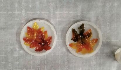 I really enjoy creating art with epoxy resin because of the glossy, durable finish it produces on many of my colorful projects. I love that it preserves and enhances whatever medium I choose for my creations. I wanted a change from painting and when I saw a package of faux fall leaves at my Dollar Store, I decided to turn them into resin coasters using my favorite silicone molds. Countertop epoxy provides high shine, water-resistant finishes and is commonly used to enhance the beauty a… Resin Coasters Diy, Countertop Epoxy, Mini Pallet Coasters, Pumpkin Wreath Diy, Borax Crystals, Coasters Diy, Rag Garland, Epoxy Countertop, Beads Candy