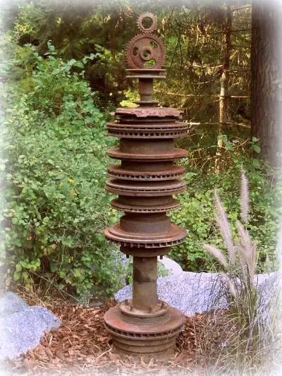 Gears and gadgets as garden art | Flea Market Gardening Rock Garden Decor, Hanging Rock, Flea Market Gardening, Garden Rock Art, Gear Art, Welding Art Projects, Flower Sculptures, Metal Garden Art, Garden Art Projects