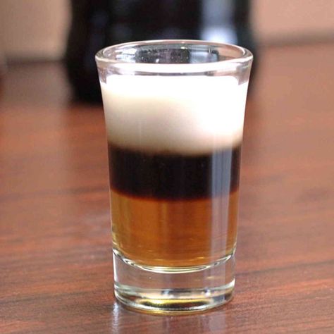 The classic B52 shot recipe layers Kahlua, then Bailey's Irish Cream, and then Grand Marnier on top. The flavor of a B52 is described by some bartenders as a little like caramel. B52 Shot, Kahlua Drinks, Shooter Recipes, Layered Drinks, Cocktail Shots, Colorful Cocktails, Orange Caramel, Caramel Candy, Cocktail Mix